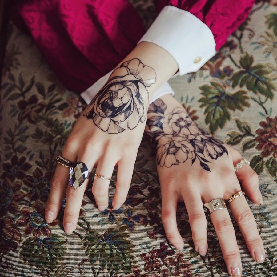 hand flower tattoo by zihwa_tattooer