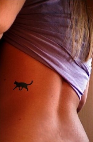 Minimalistic cat tattoo