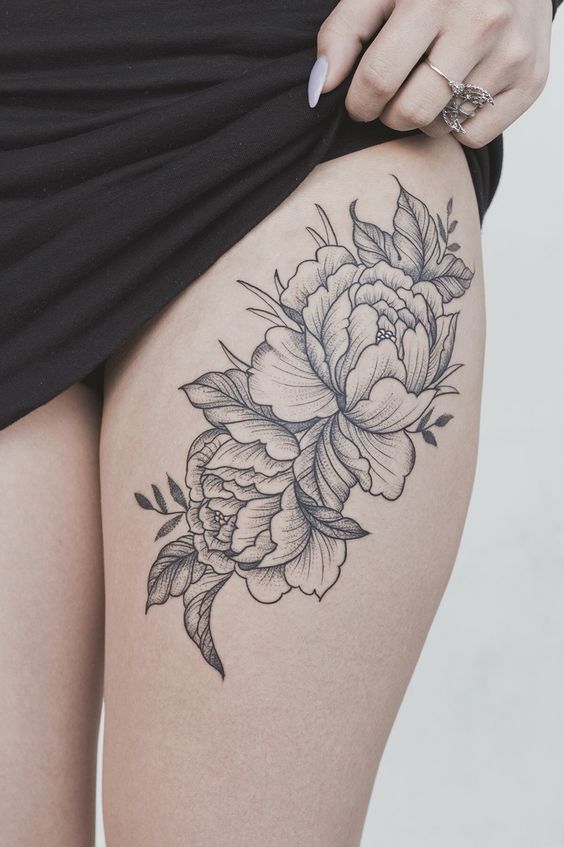 Peony flower on thigh tattoo