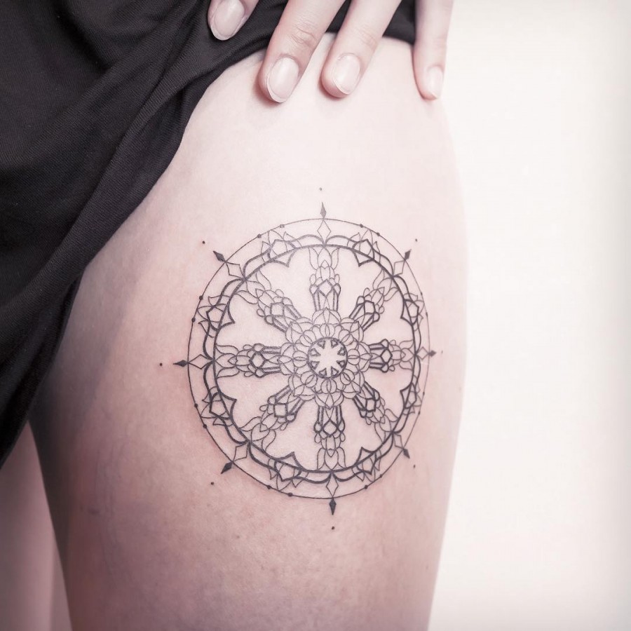 the wheel of dharma dattoo by xoxotattoo