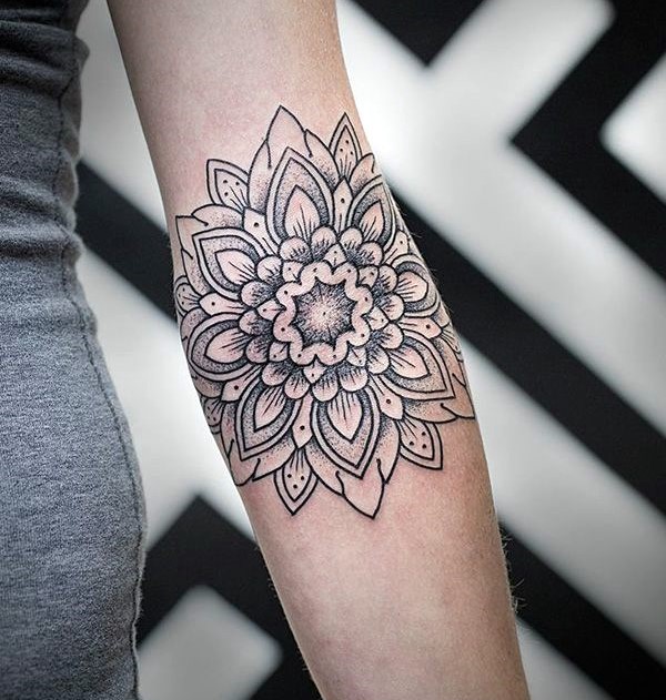 black and grey mandala tattoo