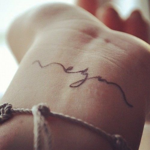 animal rights tattoo lettering wrist tattoo