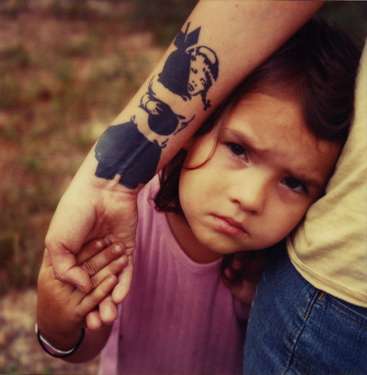 banksy graffiti tattoo girl holding bomb