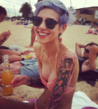 beach girl tattoo girl with piercing blue hair