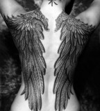 black and white photo huge wings back tattoo