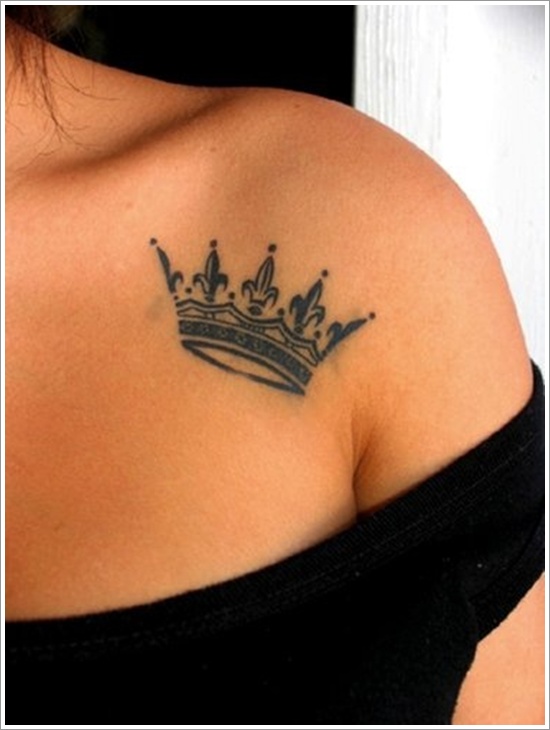 crown tattoo black work on shoulder