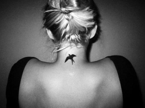 elegant bird tattoo back neck black work