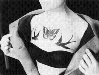 elegant bird tattoo on chest butterfly