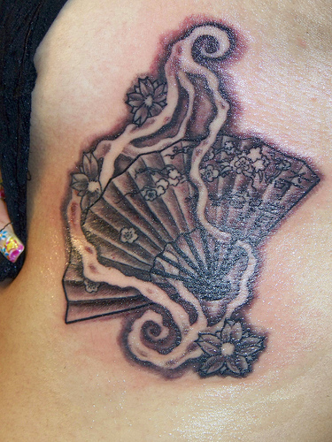 fan tattoo small back