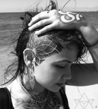 geometric abstract tattoo flower on head