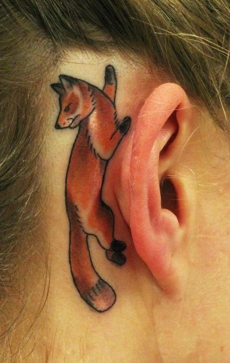 behind ear tattoo fox lying on ear