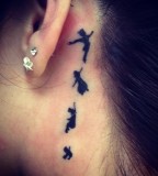 behind ear tattoo peter pan black work