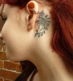 behind ear tattoo red haired girl