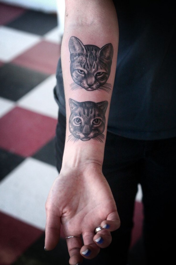 cat head on inside arm tattoo