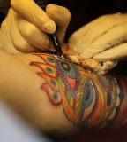 colorful tattoo in process