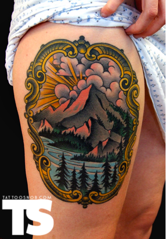 grand mountain tattoo on thigh