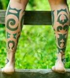 green tribal leg tattoos by idexa stern