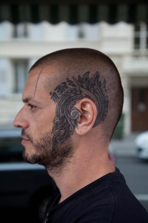 head tattoo around ear blue ink