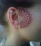 in front of ear tattoo red heart paisley