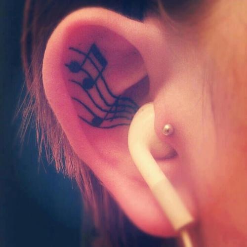 inside ear tattoo musical note