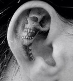 inside ear tattoo skeleton