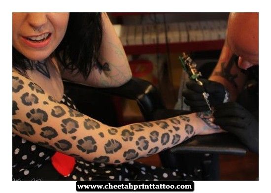 leopard print tattoo on arm in process