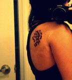 leopard print tattoo on shoulder