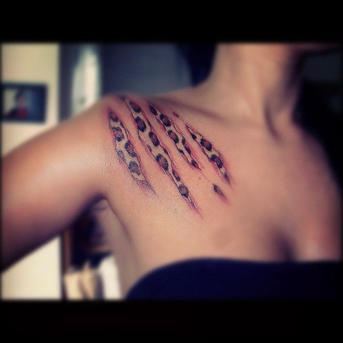 leopard print tattoo skin tear