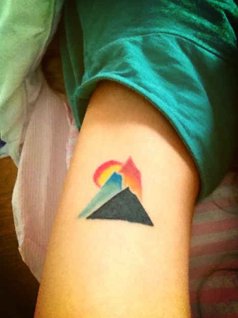 mountains and sun tattoo