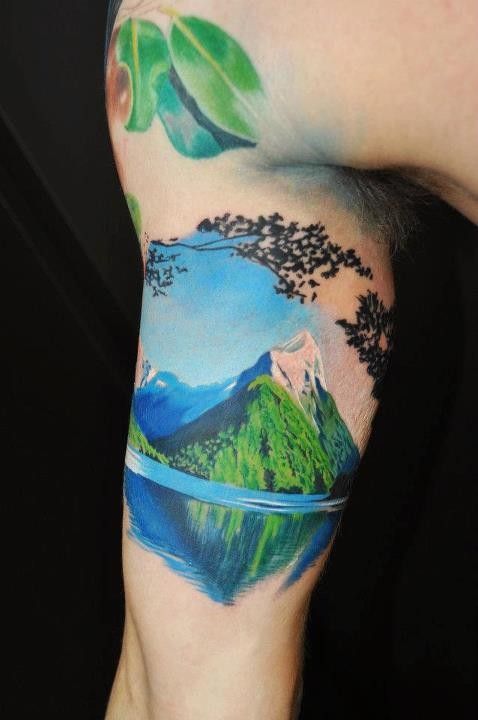 realistic mountain tattoo on arm