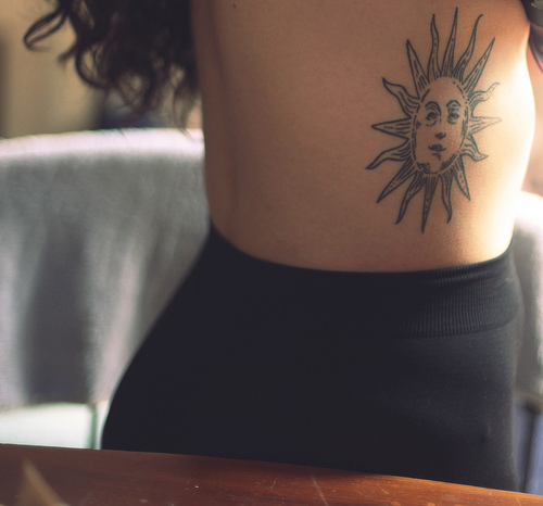 sun tattoo design sun on ribs