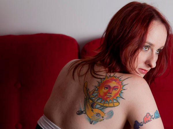 sun tattoo sunny delights red haired girl