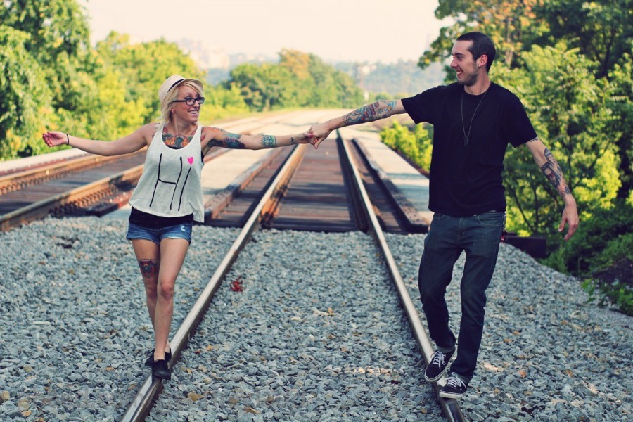 tattooed couple on rails