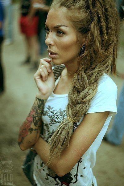 tattooed girl with dreadlocks blonde  arm tattoo