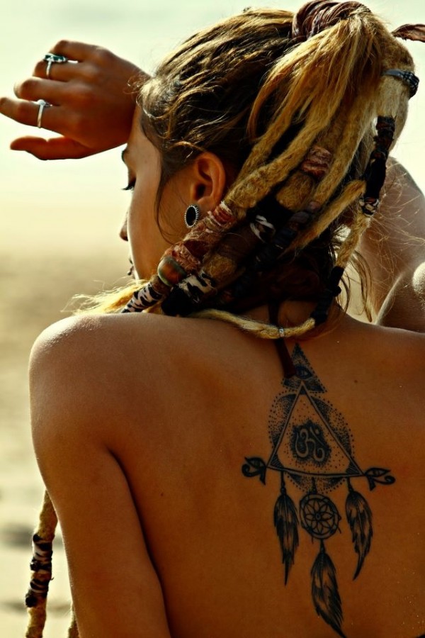 tattooed girl with dreadlocks dreamcatcher design