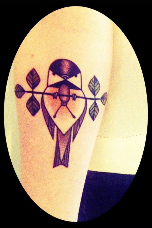 bird on a branch tattoo inspired by charley harper