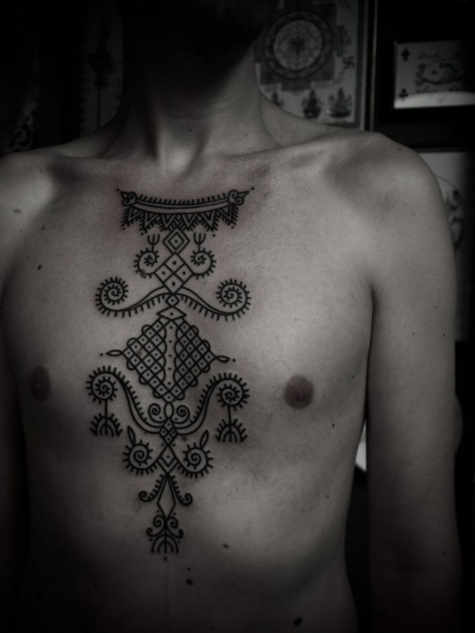 chest blackwork tattoo by guy le tattooer