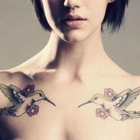 feminine colibri chest tattoo