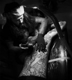 guy le tattooer working on full back piece