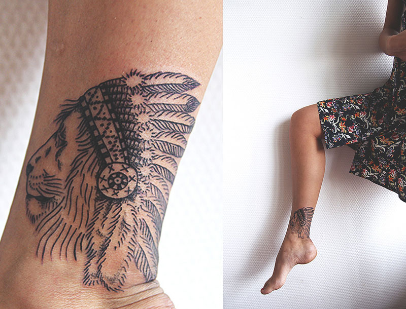 lion with indian feather head dressing tattoo by diana katsko