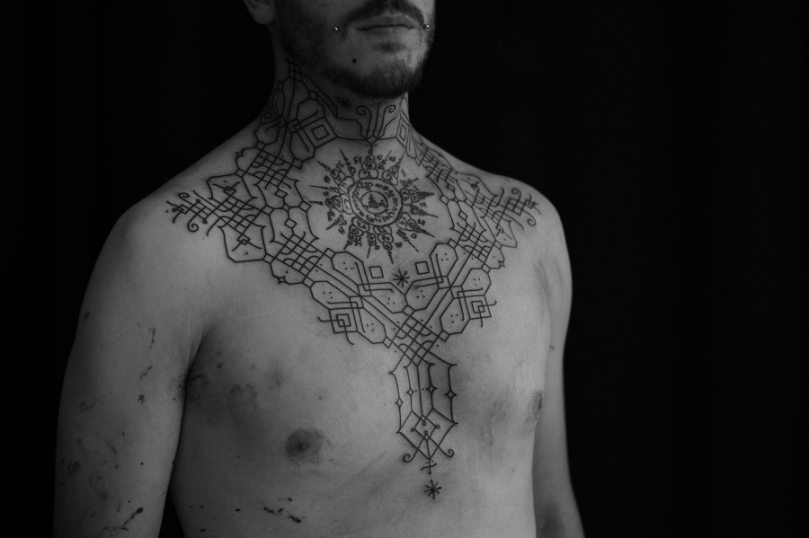 neck and chest tattoo by jean philippe burton