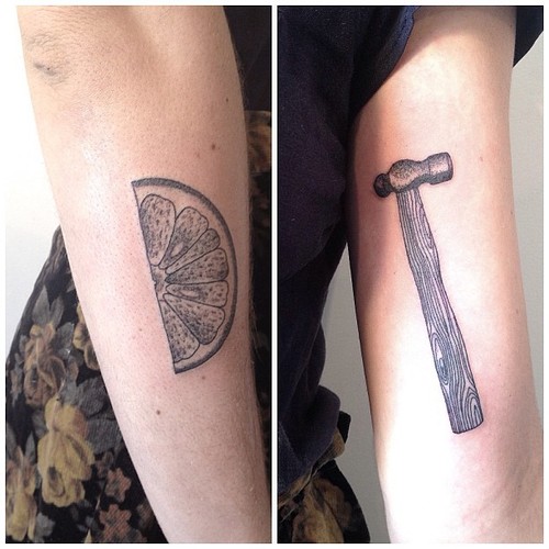 orange and hammer tattoo by victor j webster