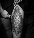 ornamental design thigh tattoo by guy le tattooer