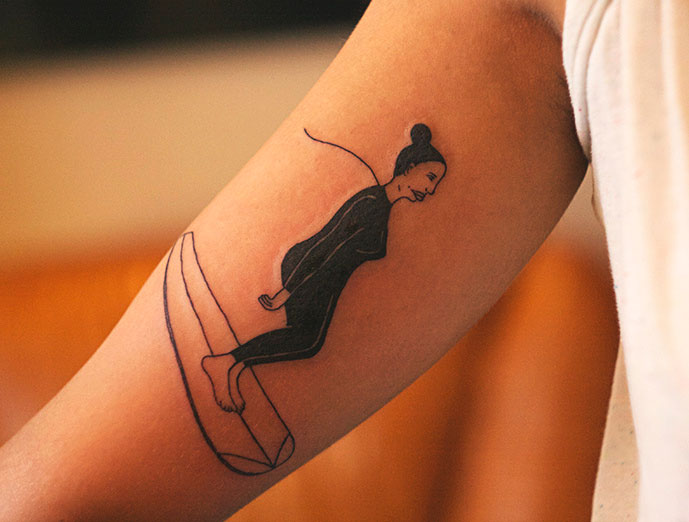 surfing woman tattoo by diana katsko