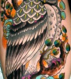 Big and colorful owl tattoo