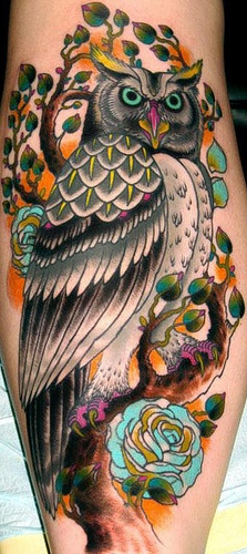 Big and colorful owl tattoo