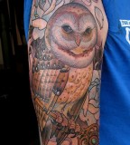 Big brown owl tattoo