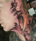 Biomech face tattoo