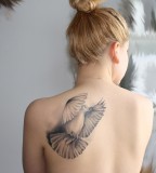 Black and white bird tattoo