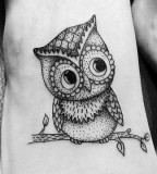 Black and white owl tattoo